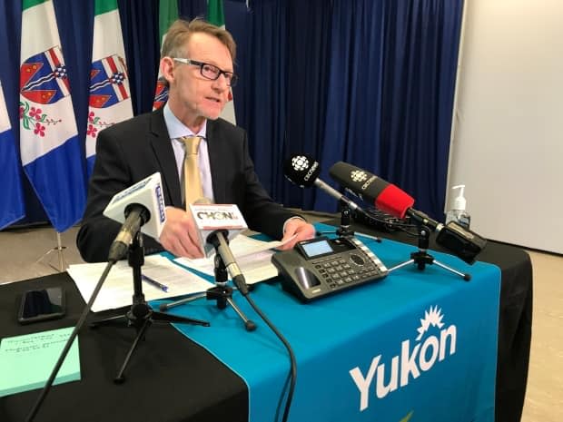 Yukon's Chief Medical Officer Dr. Brendan Hanley at a press conference in November. In a statement Friday Hanley said the territory will need to maintain some COVID-19 restrictions in order to reduce others. (Wayne Vallevand/CBC - image credit)