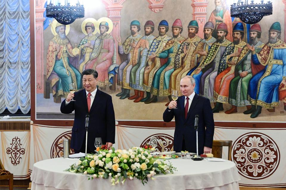 Russian President Vladimir Putin, right, and Chinese President Xi Jinping toast during their dinner at The Palace of the Facets in the Moscow Kremlin, Russia, Tuesday, March 21, 2023. (Pavel Byrkin, Sputnik, Kremlin Pool Photo via AP)