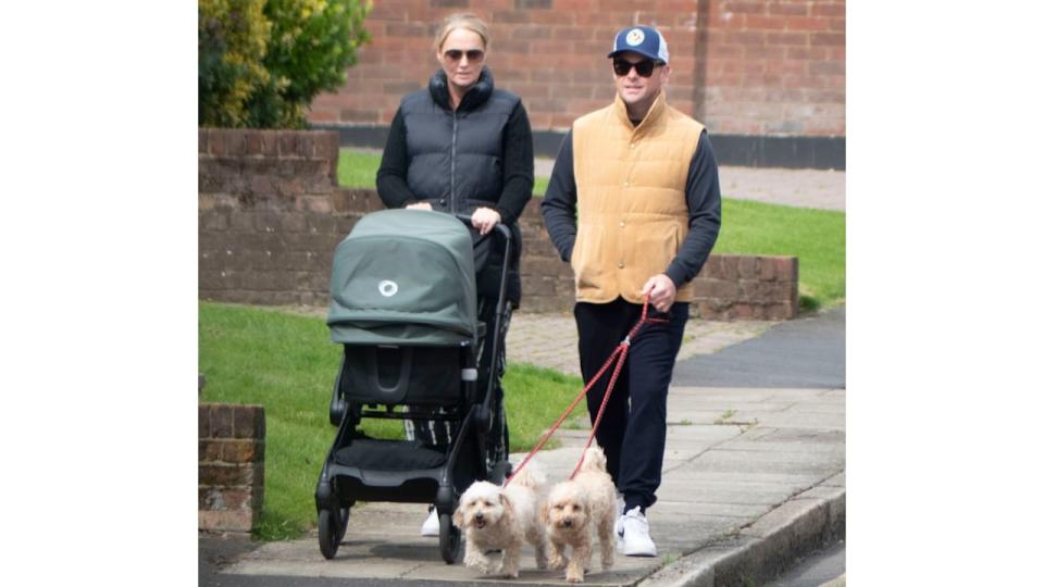 The duo appeared relaxed during their walk before bumping into their neighbours and stopping for a chat