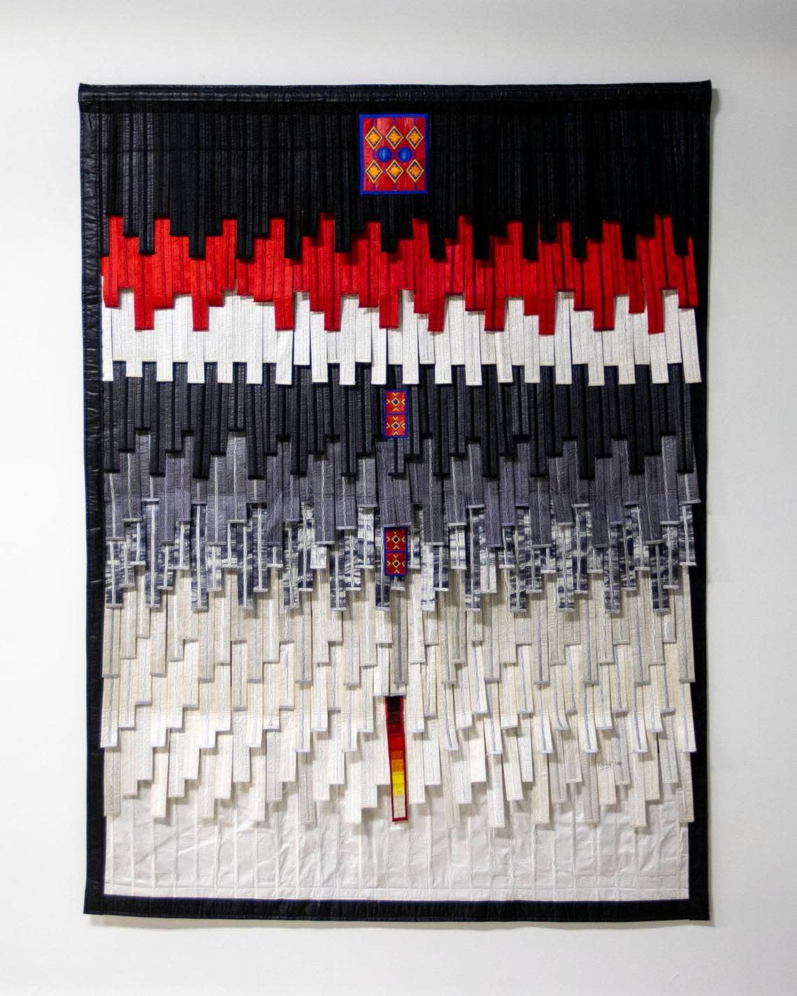 A textile piece by artist Abdoulaye Konaté displayed during the Preview for The Art of Transformation in Opa-locka, Florida, on Wednesday, November 30, 2022. The event coincides with Art Basel Miami Beach 2022 and is just one of over 40 exhibits part of 2022 Art of Black Miami.