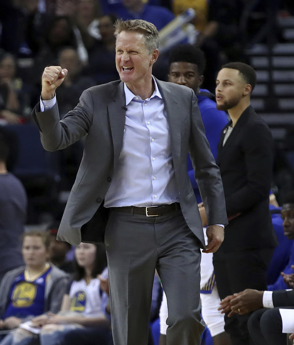 FILE - In this March 14, 2018, file photo, Golden State Warriors coach Steve Kerr gestures in front of Stephen Curry during the second half of the team's NBA basketball game against the Los Angeles Lakers in Oakland, Calif. Kerr understands the NBA's business side, free agency and everything it takes to build a perennial winner with a star-studded roster like the one he gets to coach every day. He knows what these Warriors have now will hardly last forever (AP Photo/Ben Margot, File)