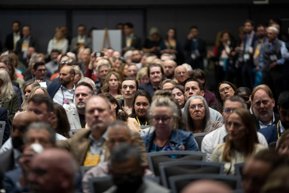 Delegates and attendees listen to Premier David Eby makes remarks during the UBCM conference in Vancouver, British Columbia on Thursday, September 19, 2024. 