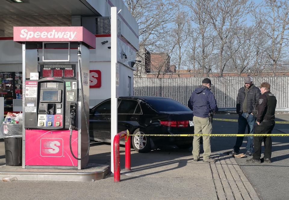 Investigators from the Brockton Police and Plymouth County Sheriff's office investigate a shooting that took place at the intersection of Turner and Wyman streets Monday afternoon, Jan. 9, 2023. After the shooting the victims drove to this Speedway gas station on North Main Street in this car to seek help.