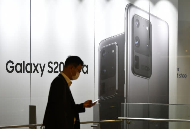 A man walks past an advertisement for the Samsung Galaxy S20 Ultra smartphone at a showroom in Seoul on July 30, 2020. - Samsung Electronics reported on July 30 its net profit grew 7.3 percent year-on-year in the second quarter, with strong demand for memory chips overcoming the impact of the coronavirus pandemic on smartphone sales. (Photo by Jung Yeon-je / AFP) (Photo by JUNG YEON-JE/AFP via Getty Images)