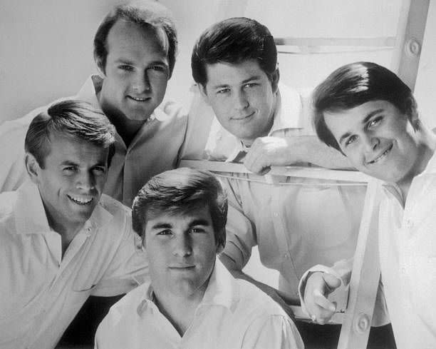 <p>The Wilson brothers, who later became the Beach Boys, grew up around music. Their dad was a professional songwriter, and the eldest son, Brian, studied music theory; he taught his younger brothers to sing. The brothers played at school dances and eventually cut a demo called “Surfin” in 1961. Their unique doo-wop sound with a California twist was picked up by a local label and started climbing the chart, ushering in the era of surfer sounds and surfer style. In 1963, their hit “<a href="https://www.amazon.com/Surfin-U-S-A-Remastered/dp/B009B53I54/?tag=syn-yahoo-20&ascsubtag=%5Bartid%7C10063.g.35225069%5Bsrc%7Cyahoo-us" rel="nofollow noopener" target="_blank" data-ylk="slk:Surfin’ USA;elm:context_link;itc:0;sec:content-canvas" class="link ">Surfin’ USA</a>” reached #3 with its simple melody and beautiful harmonies. By 1965, five of their albums went gold.</p>