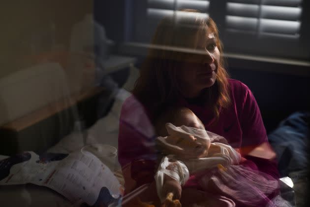 Nicole Thompson holds her son Wilder, who is being treated for the coronavirus at SSM Health Cardinal Glennon Children's Hospital in St. Louis, Missouri, on Oct. 5.  (Photo: CALLAGHAN O'HARE via REUTERS)