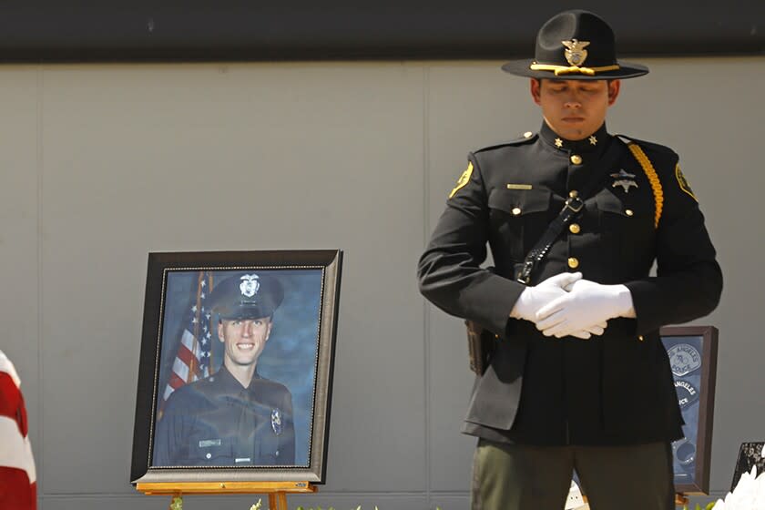 A picture of LAPD Officer Houston Tipping is shown during his memorial Wednesday at Forest Lawn Hollywood Hills.
