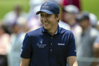 Carlos Ortiz smiles after finishing the first hole during the third round of the Wells Fargo Championship golf tournament at Quail Hollow on Saturday, May 8, 2021, in Charlotte, N.C. (AP Photo/Jacob Kupferman)