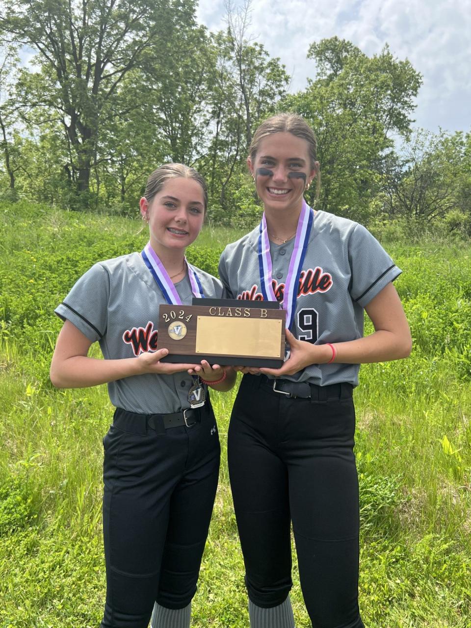 Wellsville's softball sisters Hailey, left, and Makenzie Cowburn with the Section V Class B championship brick.