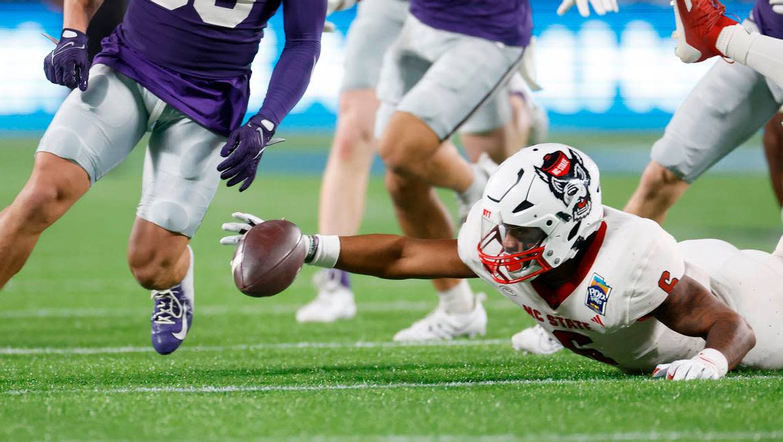 N.C. State’s Trent Pennix (6) can’t pull in the loose ball after Kansas State fumbled a punt during the first half of N.C. State’s game against Kansas State in the Pop-Tarts Bowl at Camping World Stadium in Orlando, Fla., Thursday, Dec. 28, 2023. Ethan Hyman/ehyman@newsobserver.com