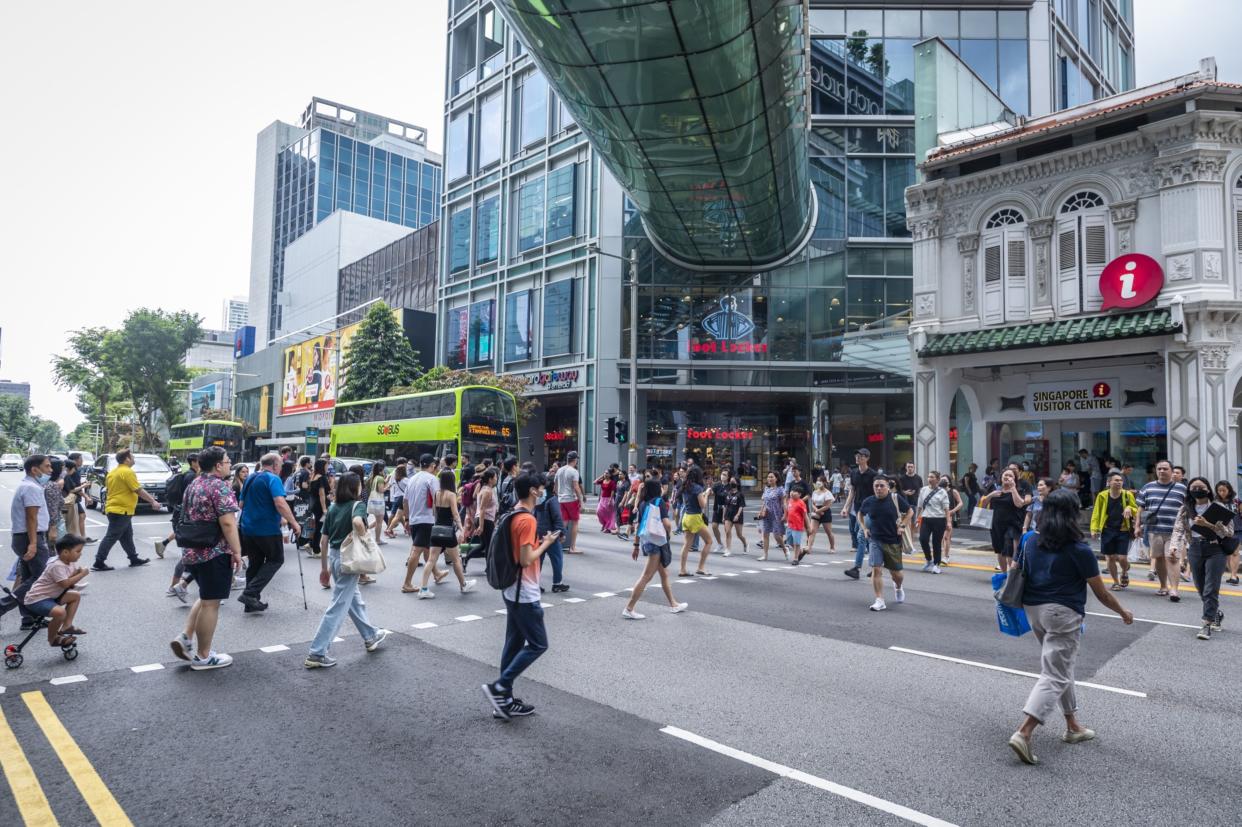 Pedestrians at Orchard Road in Singapore, on Saturday, Feb. 11, 2023. 