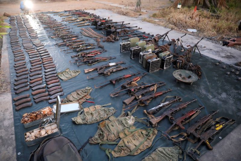 Weapons and ammunition retrieved from militants are displayed by the Rwandan security forces in Mocimboa da Praia