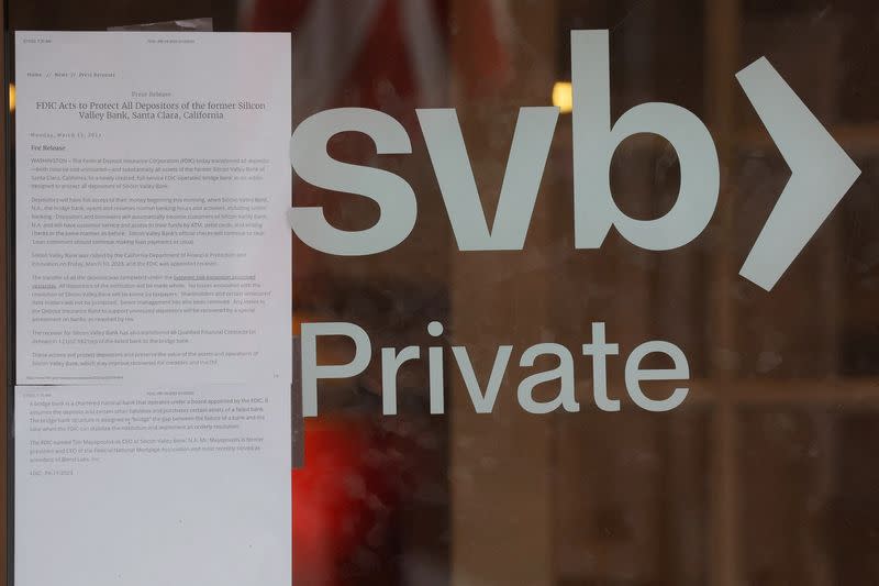 FILE PHOTO: A press release from the (FDIC) is taped to the door of a Silicon Valley Bank branch in Massachusetts