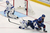 Colorado Avalanche defenseman Cale Makar (8) turns after scoring on Tampa Bay Lightning goaltender Andrei Vasilevskiy (88) during the third period in Game 2 of the NHL hockey Stanley Cup Final, Saturday, June 18, 2022, in Denver. (AP Photo/John Locher)