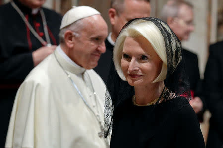 U.S. ambassador to the Holy See Callista Gingrich walks past Pope Francis during the traditional exchange of the New Year greetings in the Regal Room at the Vatican January 8, 2018. REUTERS/Andrew Medichini/Pool