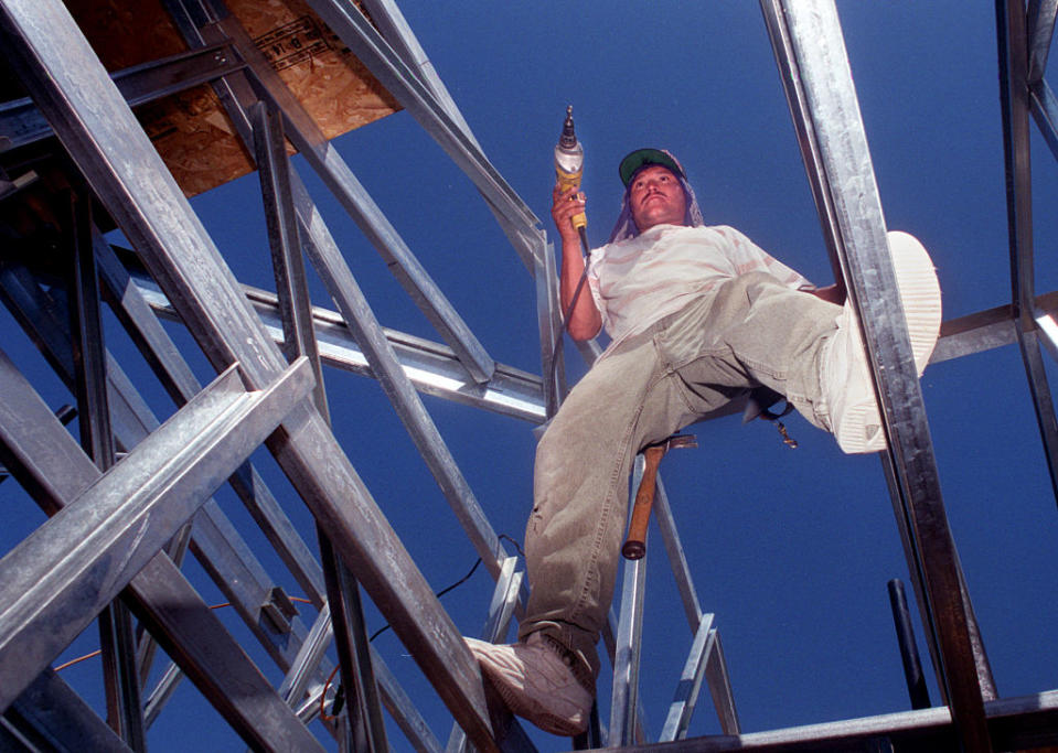 Charlie Martinez installs steel framework in a house under construction in Mission Viejo, Calif.<span class="copyright">Rick Loomis—Los Angeles Times/Getty Images</span>