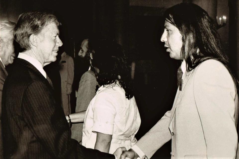 Native American Rights Fund co-founder and executive director John Echohawk shakes hands with President Carter during a late-1970s meeting.