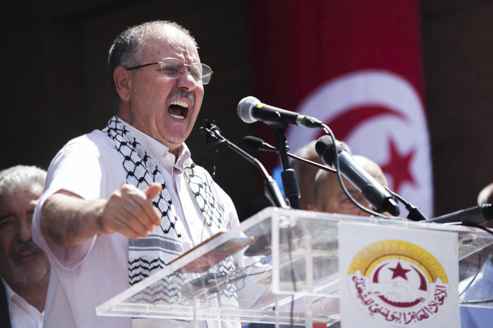 General Secretary of the Tunisian General Labor Union (UGTT) Noureddine Taboubi gives a speech during a rally in front of its headquarters in Tunis, Tunisia, Thursday, June 16, 2022. A nationwide public sector strike in Tunisia is poised to paralyze land and air transportation and other vital activities Thursday with the North African nation already in the midst of a deteriorating economic crisis. (AP Photo/Hassene Dridi)