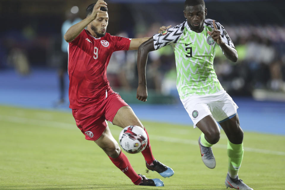 Nigeria's Jamilu Collins and Tunisia's Anice Badri fight for the ball during the African Cup of Nations third place soccer match between Nigeria and Tunisia in Al Salam stadium in Cairo, Egypt, Wednesday, July 17, 2019. (AP Photo/Hassan Ammar)