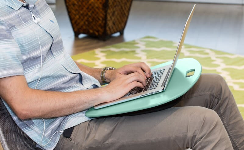 A good laptop desk can ease shoulder and neck pain, and look cute too! (Photo: Wayfair)