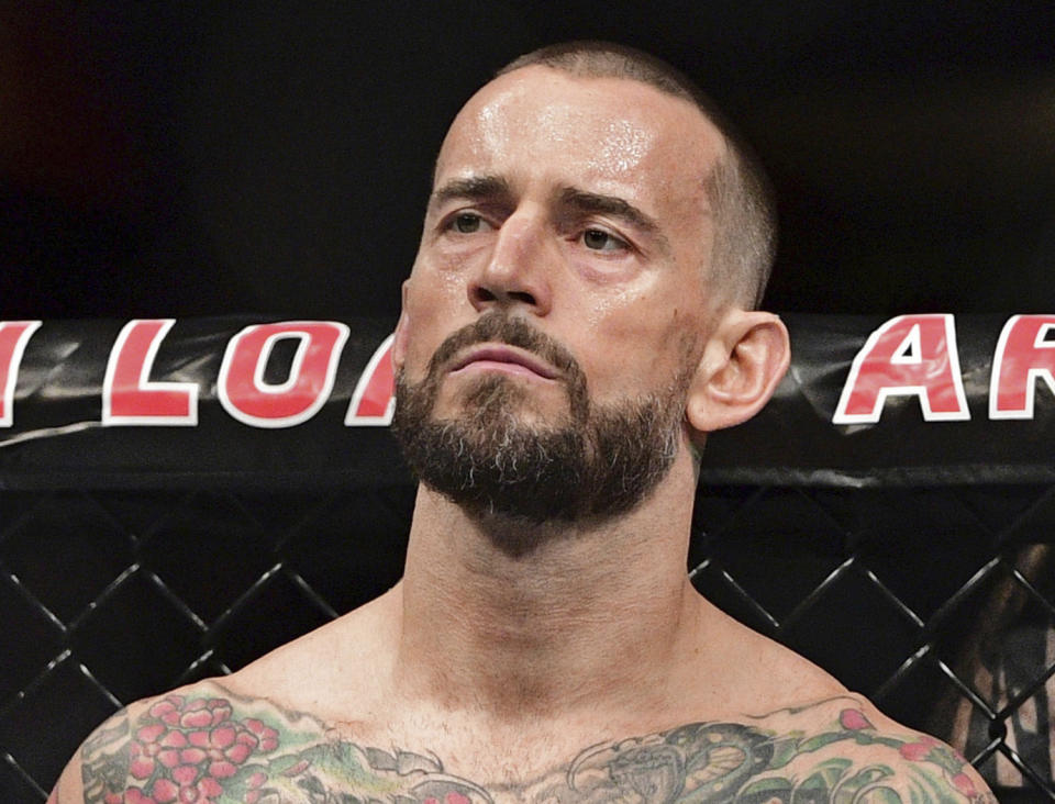 FILE - In this Sept. 10, 2016, file photo, CM Punk stands in his corner before a welterweight bout at UFC 203 in Cleveland. Punk went 0-2 in UFC and has given himself until the new year to decide if he wants to keep fighting. Punk hopes to stick in the sport as a mixed martial arts announcer. (AP Photo/David Dermer, File)