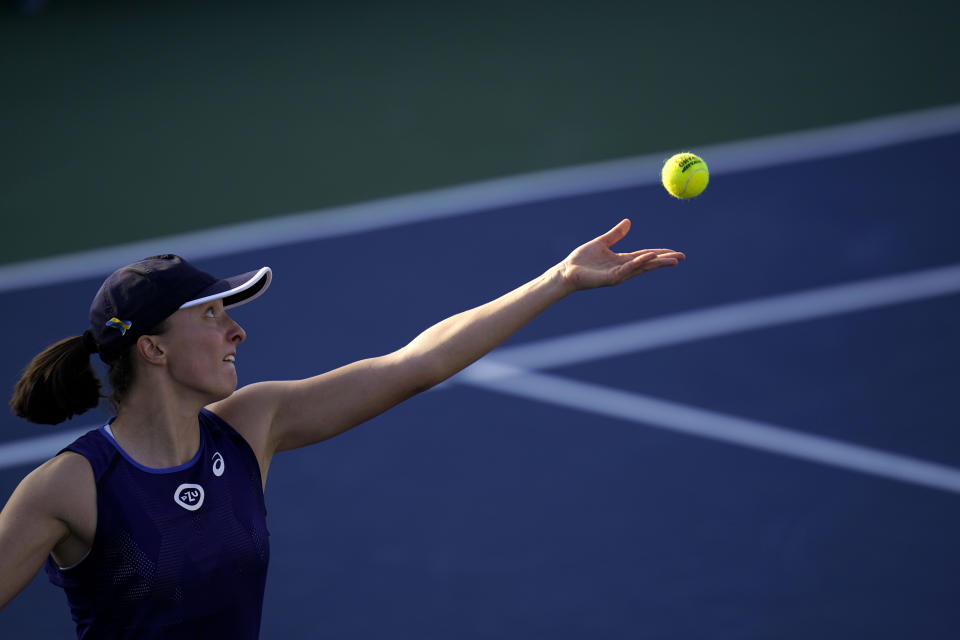 Iga Swiatek, of Poland, serves to Donna Vekic, of Croatia, during the final match at the San Diego Open tennis tournament Sunday, Oct. 16, 2022, in San Diego. (AP Photo/Gregory Bull)