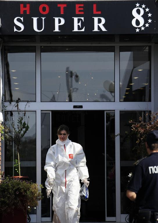 Medical staff exit the Super 8 hotel after visiting quarantined guests and personnel following the death of a British man who allegedly displayed Ebola-like symptoms, in Skopje on October 10, 2014