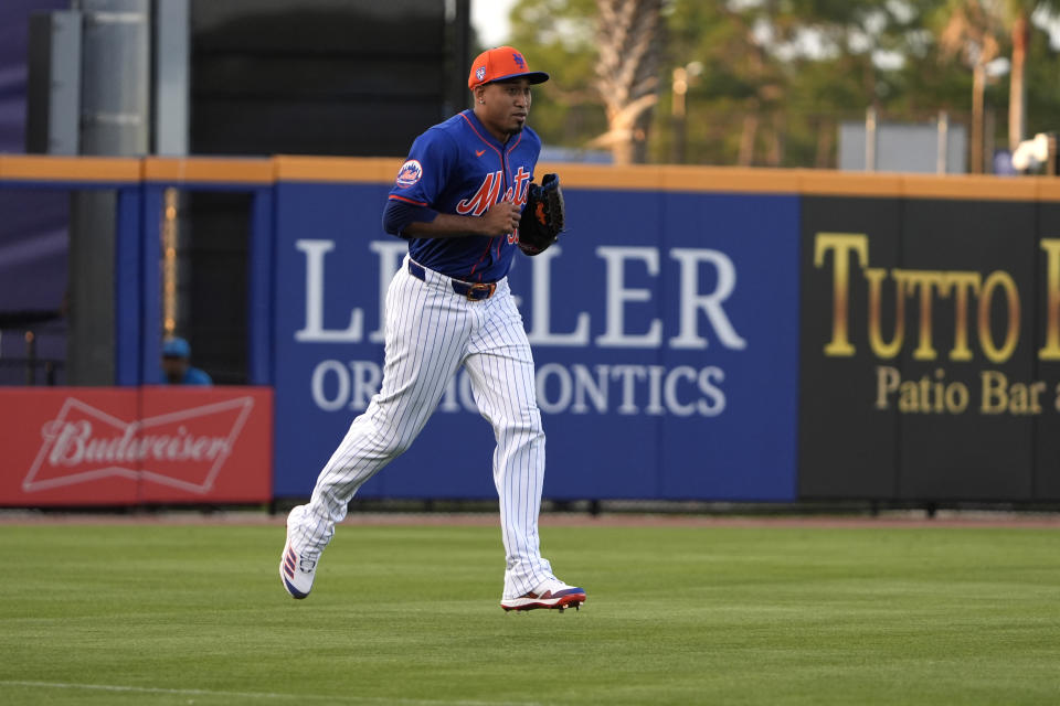 New York Mets pitcher Edwin Diaz jogs in from the bullpen to work the fifth inning of a spring training baseball game against the Miami Marlins Monday, March 11, 2024, in Port St. Lucie, Fla. (AP Photo/Jeff Roberson)