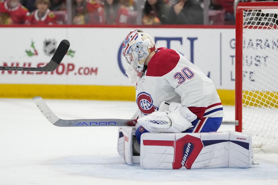 Montreal Canadiens goaltender Cayden Primeau stops the puck between his legs during the second period of the team's NHL hockey game against the Chicago Blackhawks on Friday, Dec. 22, 2023, in Chicago. (AP Photo/Erin Hooley)