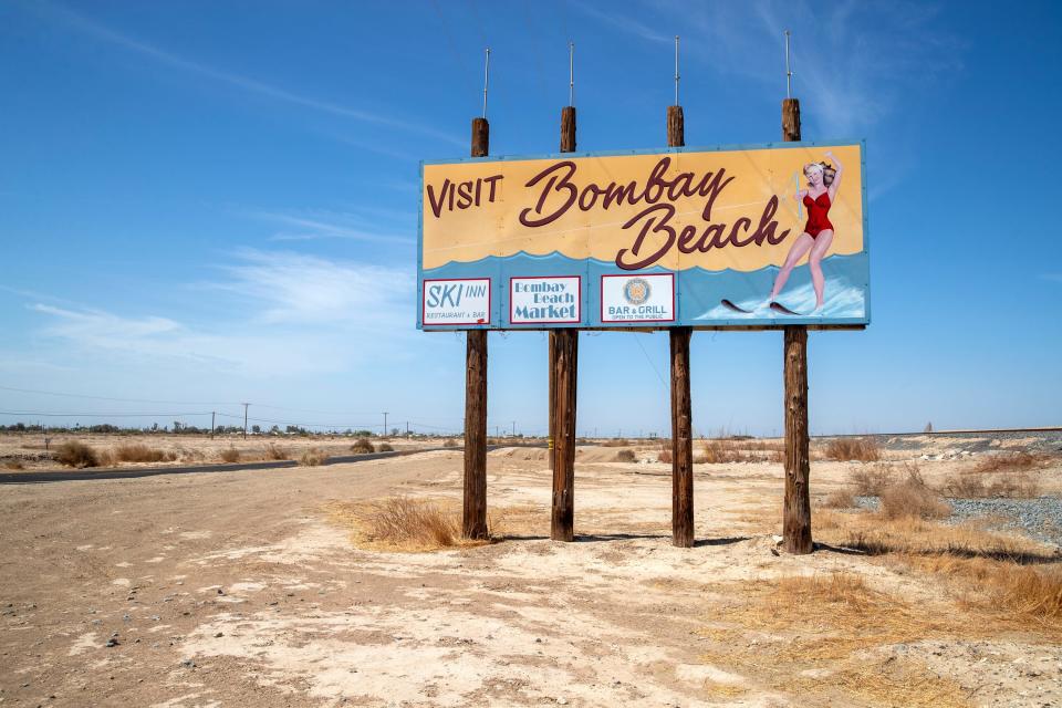 A sign welcomes visitors to Bombay Beach along State Route 111 in Bombay Beach, Calif., on August 11, 2022. 