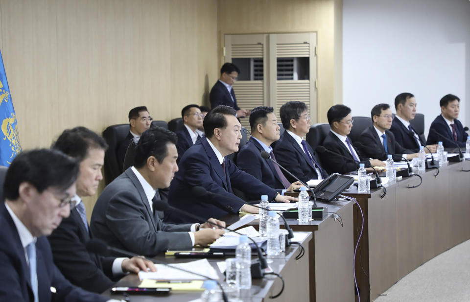 In this photo provided by South Korea Presidential Office, South Korean President Yoon Suk Yeol, fourth from left, speaks during a meeting of the National Security Council at the presidential office in Seoul, South Korea, Monday, Dec. 18, 2023. North Korea fired an intercontinental ballistic missile into the sea Monday in a resumption of its high-profile weapons testing activities, its neighbors said, as the North vows strong responses against U.S. and South Korean moves to boost their nuclear deterrence plans. (South Korea Presidential Office via AP)