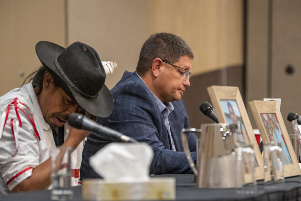 Mark Arcand, right, who's sister Bonnie Burns and nephew Gregory "Jonesy" Burns were killed during a series of violence attacks at James Smith Cree Nation over the long weekend, and Brian "Buggy" Burns, Bonnie Burns's husband, speak to media at a press conference in Saskatoon on Wednesday, Sept. 7, 2022. Myles Sanderson, 32, and his brother Damien, 30, are accused of killing 10 people and wounding 18 in a string of attacks across an Indigenous reserve and in the nearby town of Weldon. Damien was found dead Monday, and police were investigating whether his own brother killed him. (Liam Richards /The Canadian Press via AP)