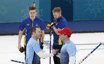 Curling - Pyeongchang 2018 Winter Olympics - Men's Final - Sweden v U.S. - Gangneung Curling Center - Gangneung, South Korea - February 24, 2018 - Vice-skip Tyler George of the U.S. and skip John Shuster of the U.S. react in front of lead Christoffer Sundgren of Sweden and skip Niklas Edin of Sweden. REUTERS/Cathal McNaughton