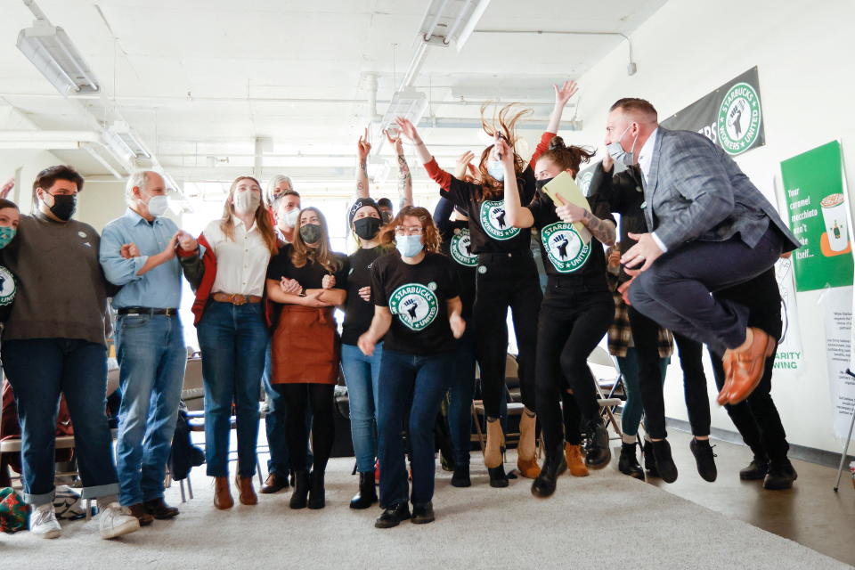 Members react during Starbucks union vote in Buffalo, New York, U.S., December 9, 2021.  REUTERS/Lindsay DeDario      TPX IMAGES OF THE DAY