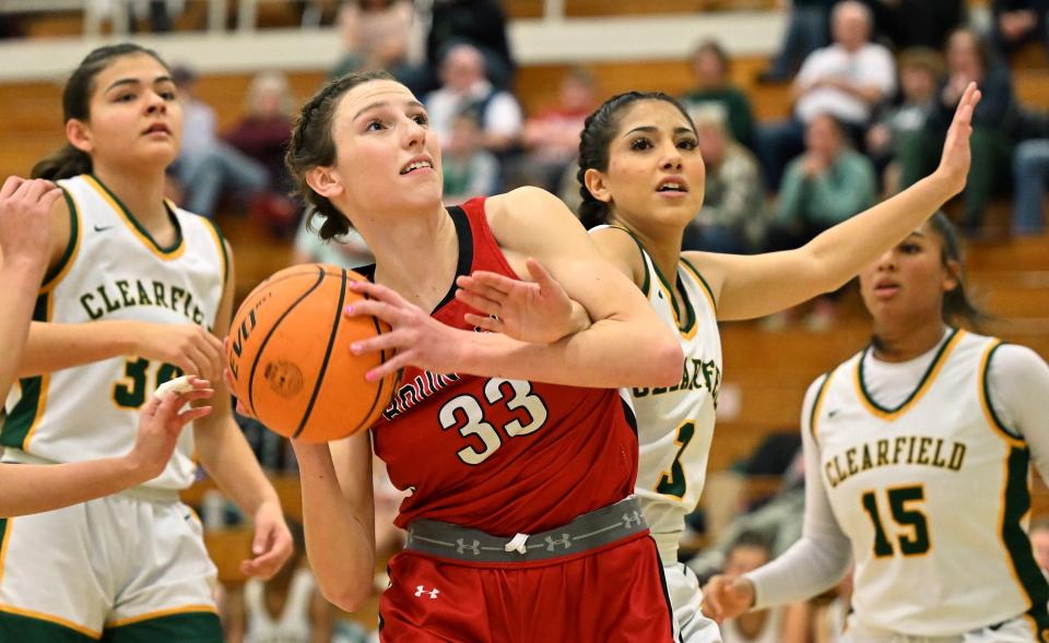 Bountiful’s Mae Johnson is fouled by Clearfield’s Nevea Cordova as they play at Clearfield on Wednesday, Jan. 17, 2024. Bountiful won 56-47. | Scott G Winterton, Deseret News