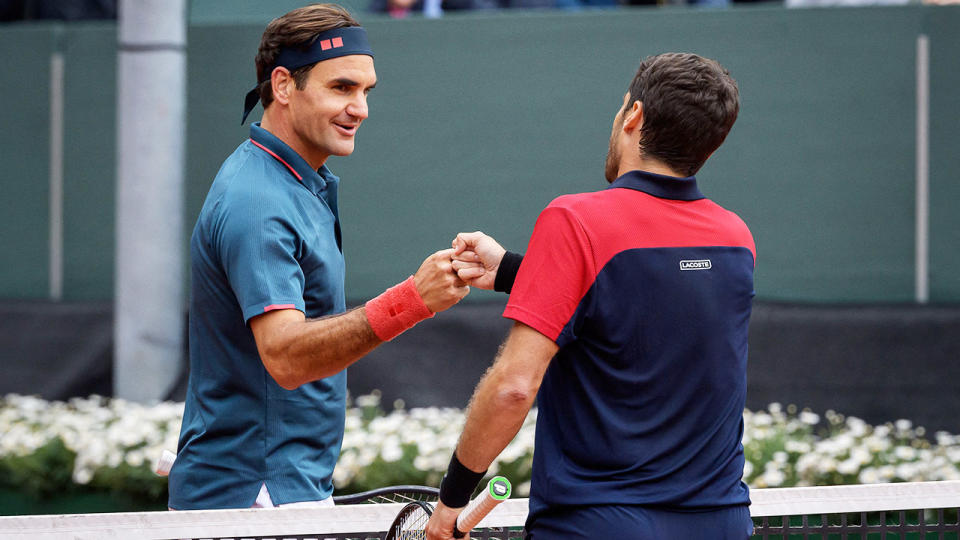 Roger Federer, pictured here congratulating Pablo Andujar after their match at the Geneva Open.