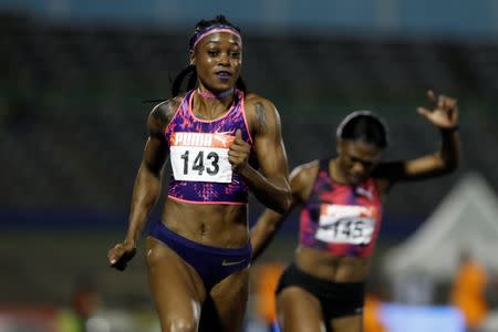 Athletics - JAAA National Senior Championships - National Stadium Kingston, Jamaica - June 23, 2017 Jamaica's Elaine Thompson (L) and Christania Williams in action during the Women's 100m final REUTERS/Lucy Nicholson