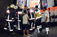 Paramedics help the injured outside Turkey's largest airport, Istanbul Ataturk, Turkey, following a blast June 28, 2016. REUTERS/Ismail Coskun/IHLAS News Agency