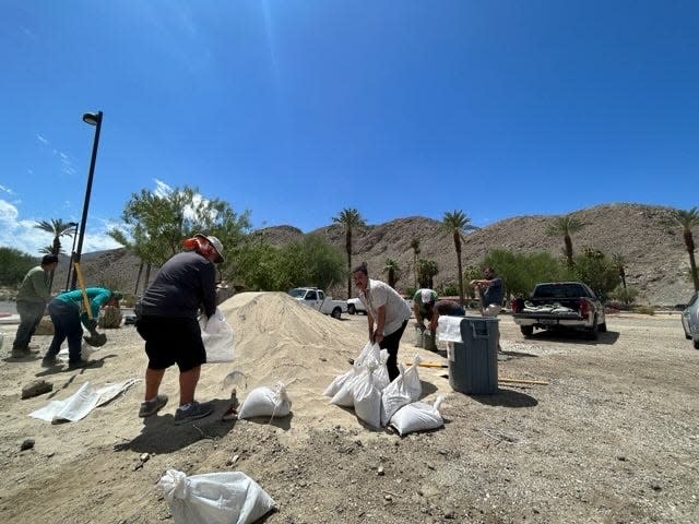 People gather sand bags at The Rancho Mirage Library and Observatory at 71100 Highway 111 ahead of Hurricane Hilary which was a tropical storm on Friday, August 18, 2023.