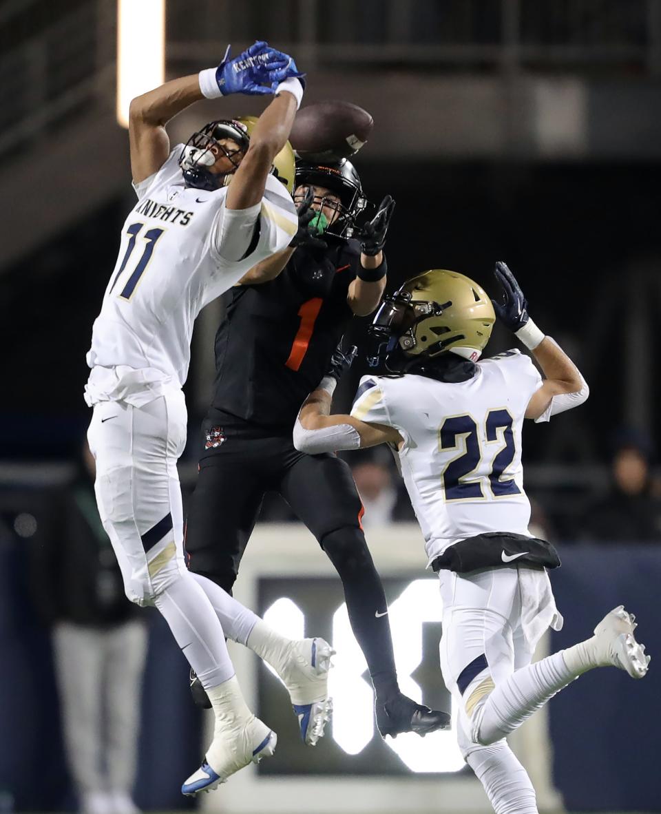 Hoban defensive back Elbert Hill IV, left, tips a pass intended for Massillon wide receiver Braylyn Toles in the second half Thursday.