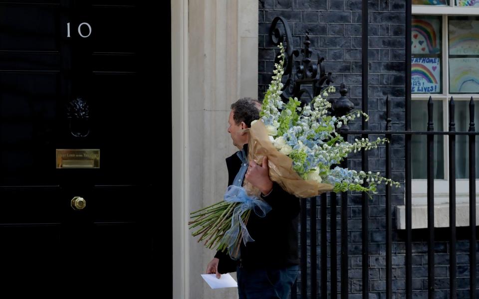 Flowers are delivered to 10 Downing Street after Boris Johnson's partner Carrie Symonds gave birth to baby Wilfred - AP