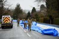 Soldiers laying flood defences in Scottish towns. (Getty)