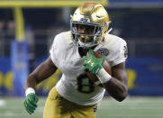 FILE - In this Dec. 29, 2018, file photo, Notre Dame wide receiver Jafar Armstrong (8) runs the ball against Clemson during the NCAA Cotton Bowl football game, in Arlington, Texas. Armstrong returns to the backfield for Notre Dame. (AP Photo/Michael Ainsworth, File)