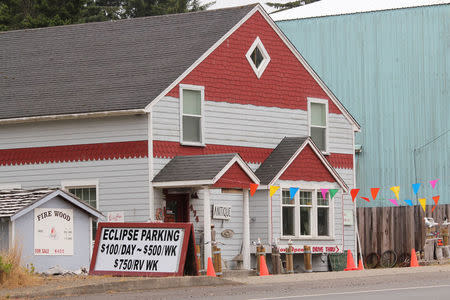 A parking sign for people visiting for the Solar Eclipse is shown in Depoe Bay, Oregon, U.S. August 9, 2017. REUTERS/Jane Ross/Files