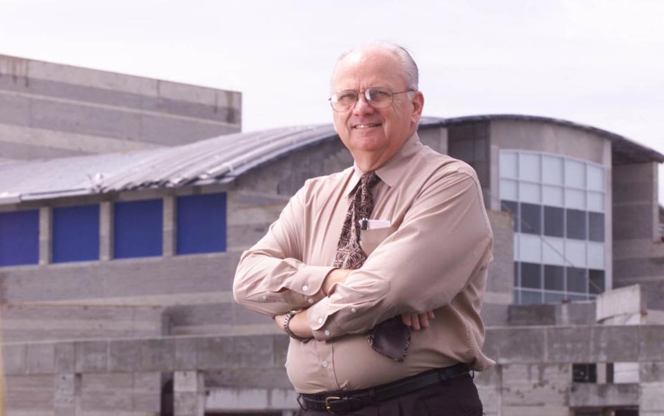 Gene Matthews poses for a photo on the site of North Port High School in July 2001. The former Sarasota County Commissioner and School Board member was instrumental in getting the land where North Port High School was built.