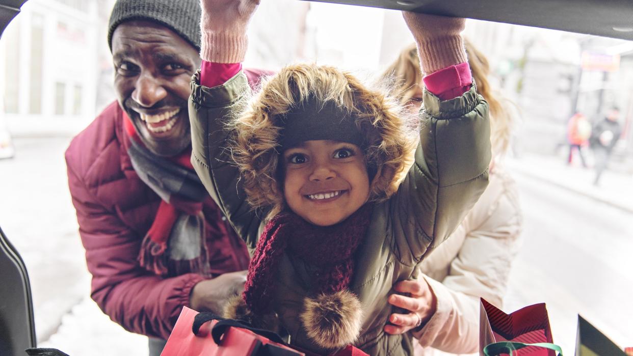 Multi-racial family shopping for Christmas.