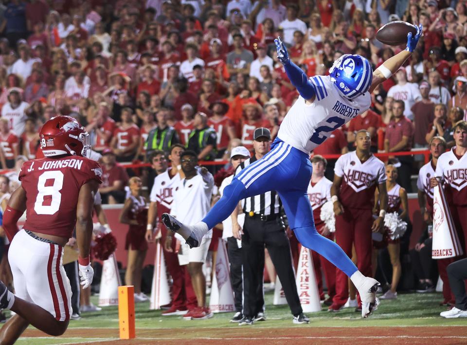 Brigham Young Cougars wide receiver Chase Roberts (2) makes a touchdown catch past Arkansas Razorbacks defensive back Jayden Johnson (8).