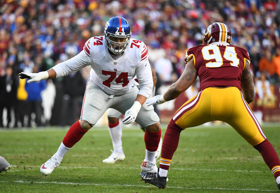 New York Giants offensive tackle Ereck Flowers (74) prepares to block Washington Redskins linebacker Preston Smith (94) during the first half at FedEx Field.