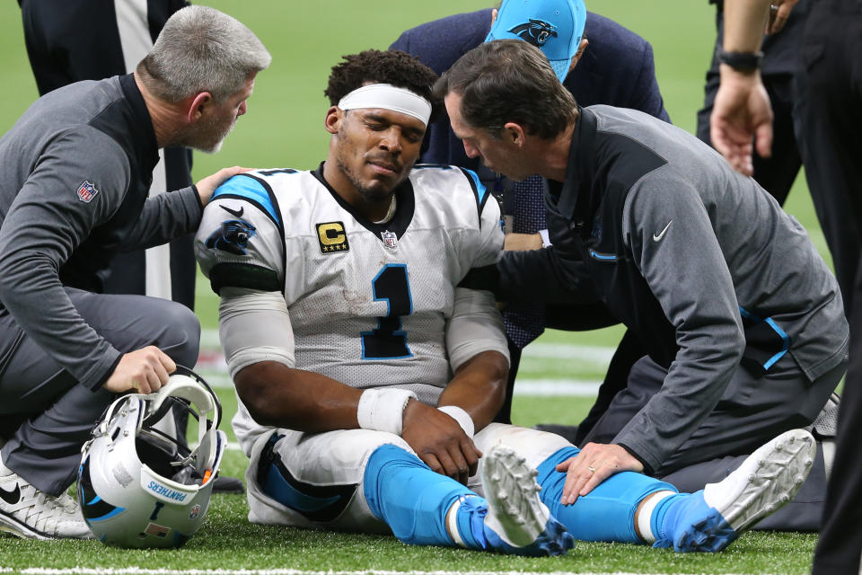 Jan 7, 2018; New Orleans, LA, USA; Carolina Panthers quarterback Cam Newton (1) is examined after being tackled by the New Orleans Saints during the fourth quarter in the NFC Wild Card playoff football game at Mercedes-Benz Superdome. Mandatory Credit: Chuck Cook-USA TODAY Sports