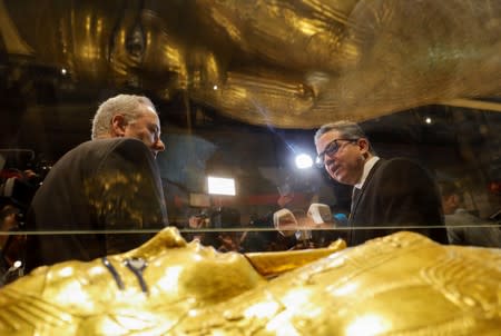 Egypt's Antiquities Minister Khaled El-Enany and US Charge d'Affaires in Cairo Thomas Goldberger talk to media near the Gold Coffin of Nedjemankh at the National Museum of Egyptian Civilization (NMEC)